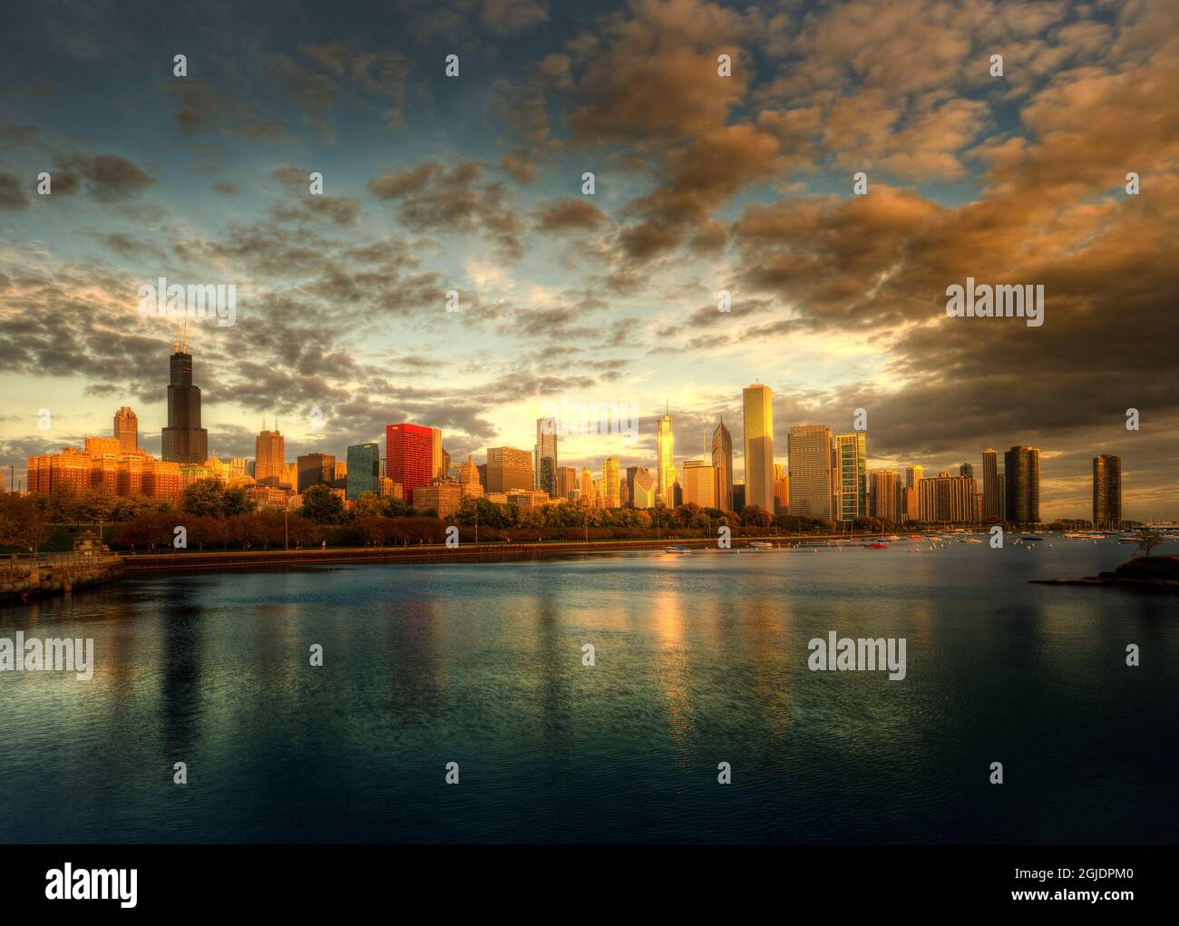 Chicago skyline over lake Michigan as sunrise enters a new day Stock Photo