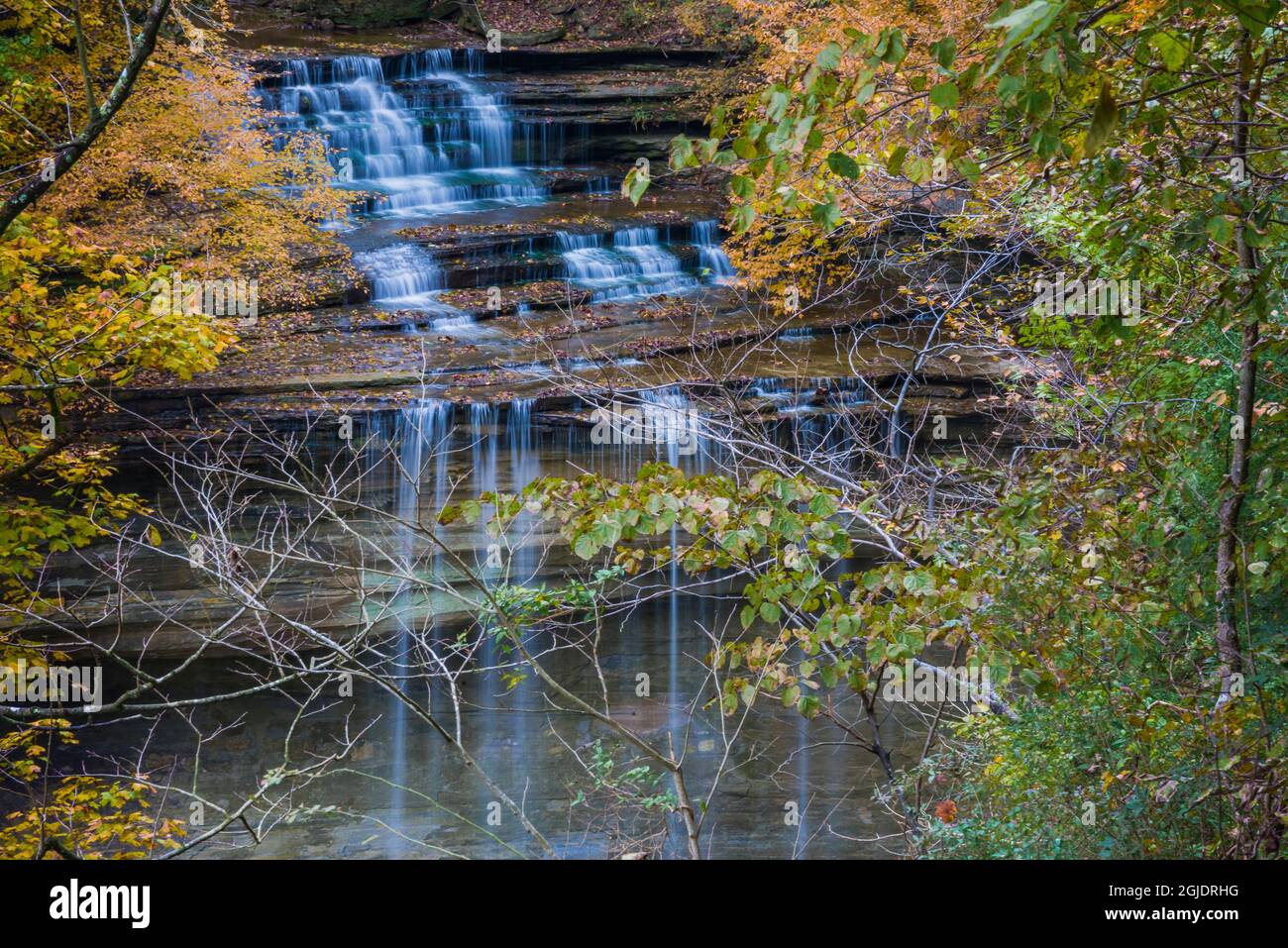 Fall Foliage Over Waterfall At Clifty Creek Park Indiana Stock Photo