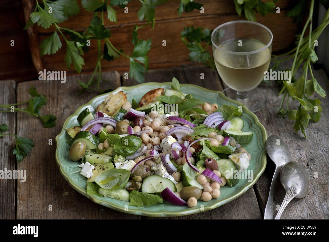 Chickpea salad with croutons, avocado, red onion, olives and feta ...
