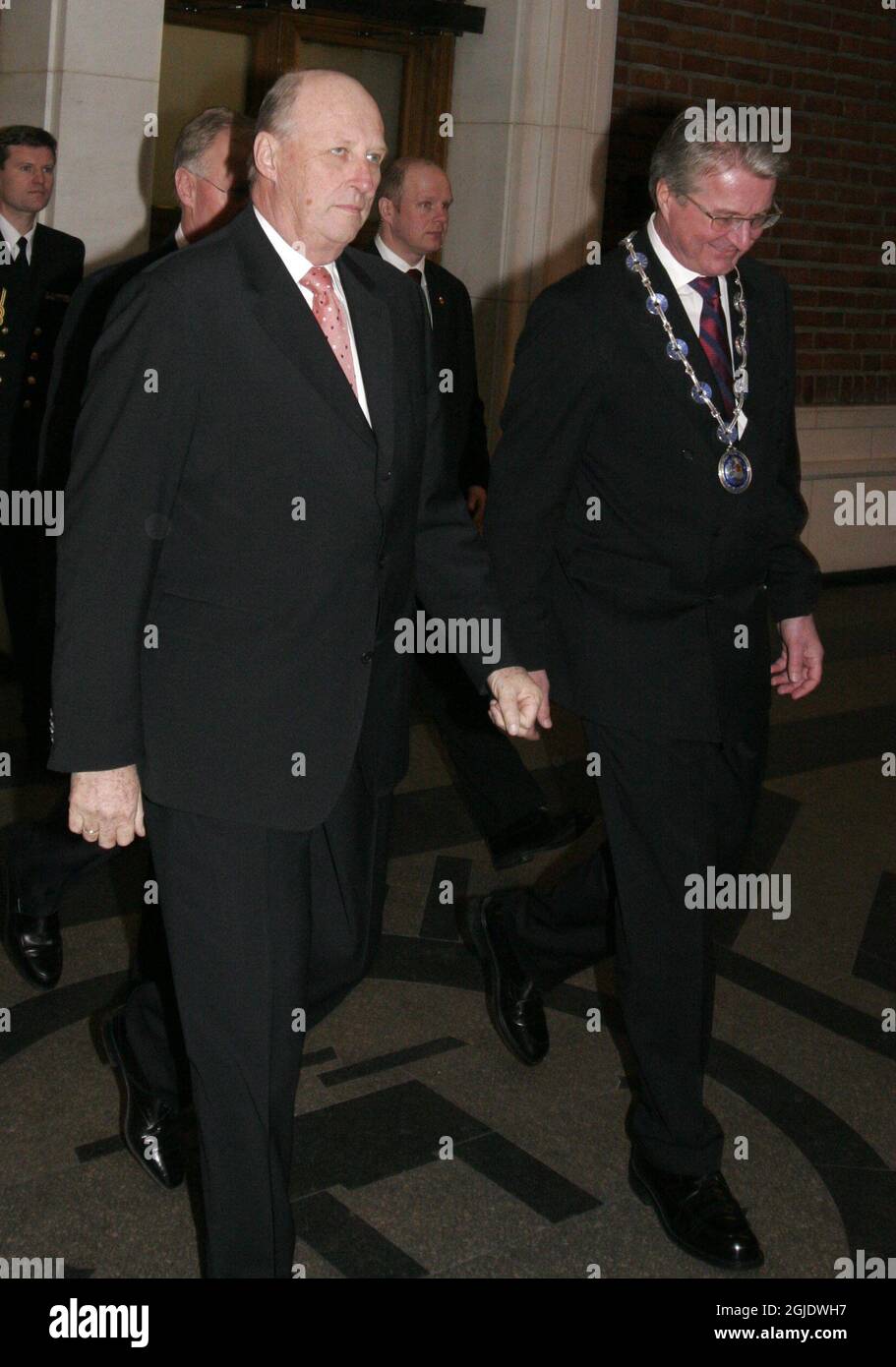 King Harald, of Norway, left, and Oslo Mayor Fabian Stang, right, attends the 100 anniversery of the Norwegian Ski Association at Oslo City Hall in capital city Oslo, Norway. Stock Photo