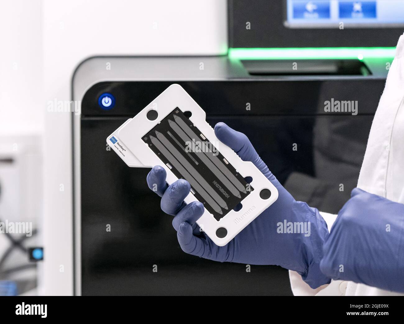 A flow cell is fed into the sequencing instrument used to search for