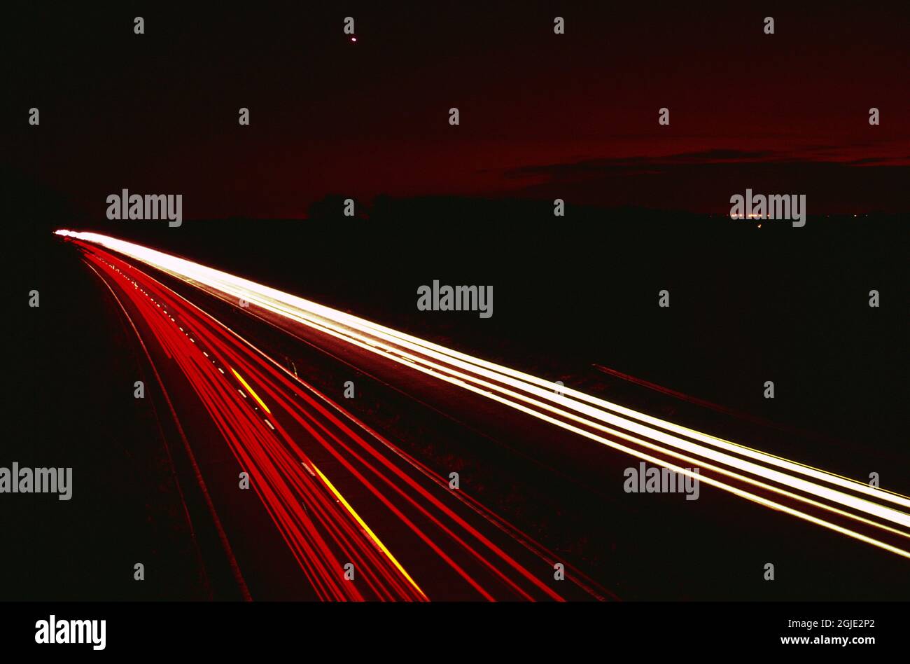 Red light trails at night. Red and white lines on dark background Stock ...
