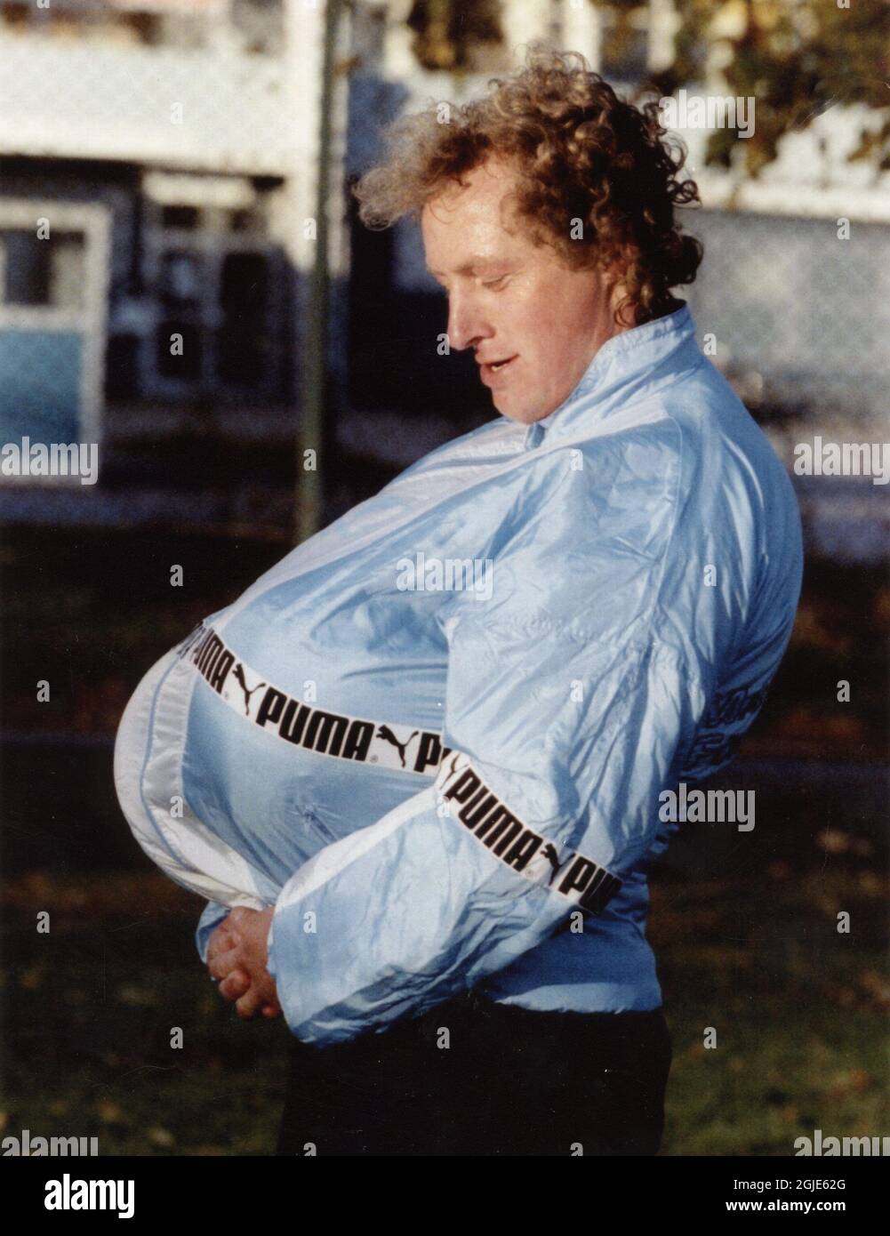 Robert Prytz of Malmo fooling around with footballs under his jacket  because he got criticized that he was too fat Stock Photo - Alamy