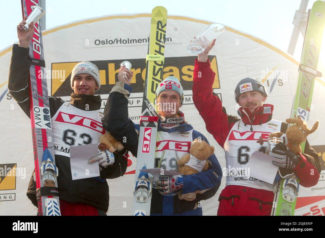 Poland's Adam Malysz (r) winner of the Men's World Cup ski jump with Norway's Roar Ljokelsoy (c) and Austria's Florian Liegl (l) who shared second place Stock Photo
