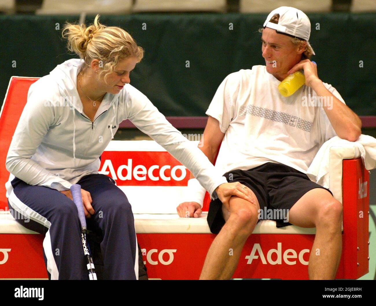 Australia's Lleyton Hewitt (r) gets a massage from his girlfriend, Belgian tennis player Kim Clijsters (r),  during the training session Stock Photo