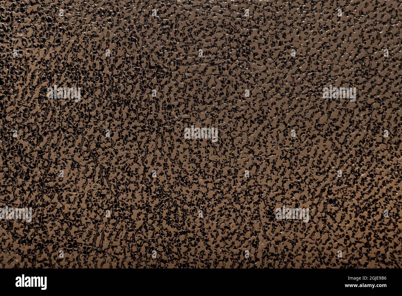 Light yellow imitation leather background. Material or pattern with irregular texture. Leather Stock Photo