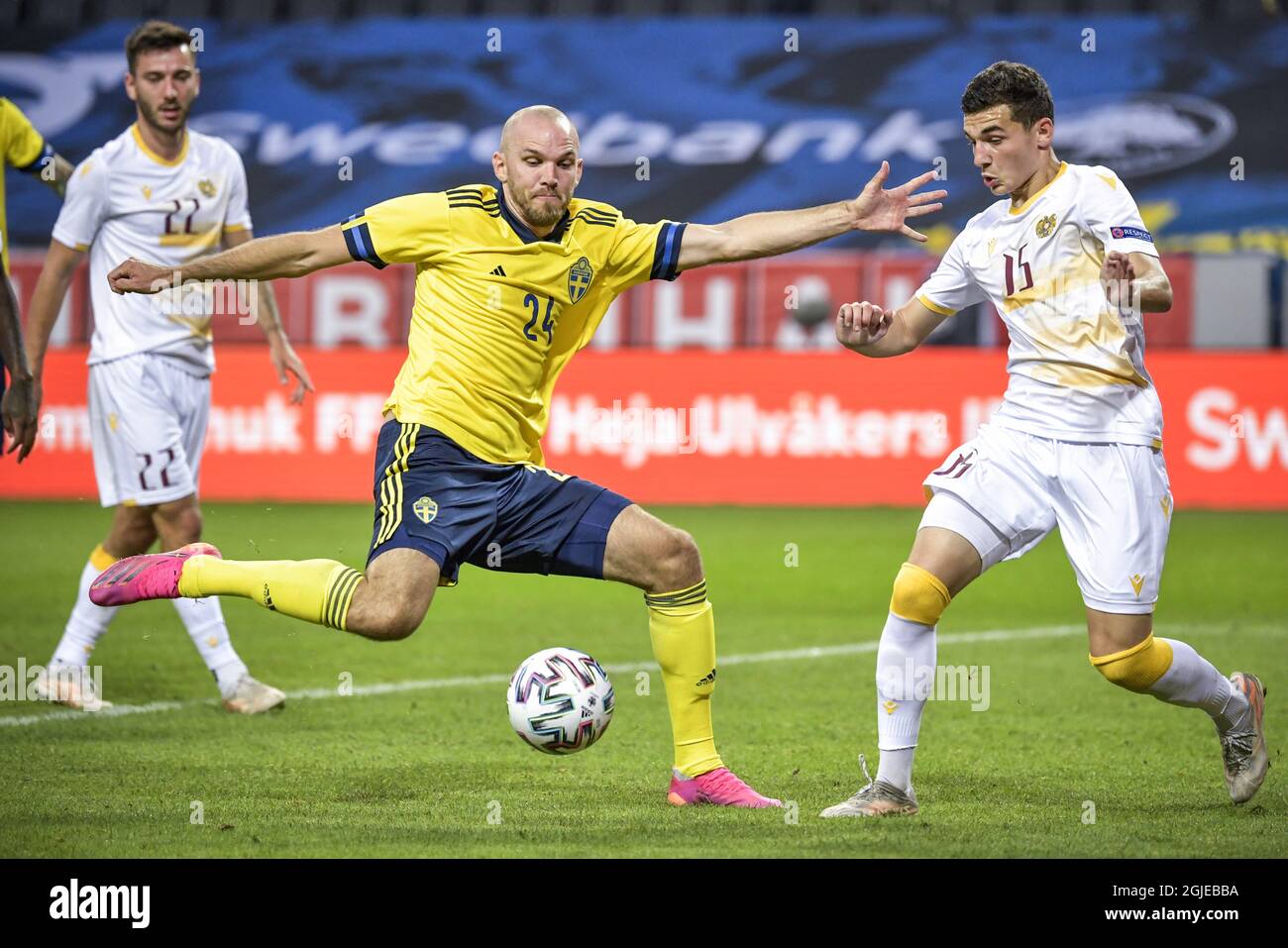 Sweden's Marcus Danielson (C) and Armenia's Eduard Spertsyan (R) fight for the ball during the International Friendly soccer match between Sweden and Armenia at Friends Arena in Stockholm, Sweden, on June 5, 2021. Photo: Janerik Henriksson / TT / code 10010 *** SWEDEN OUT ***  Stock Photo
