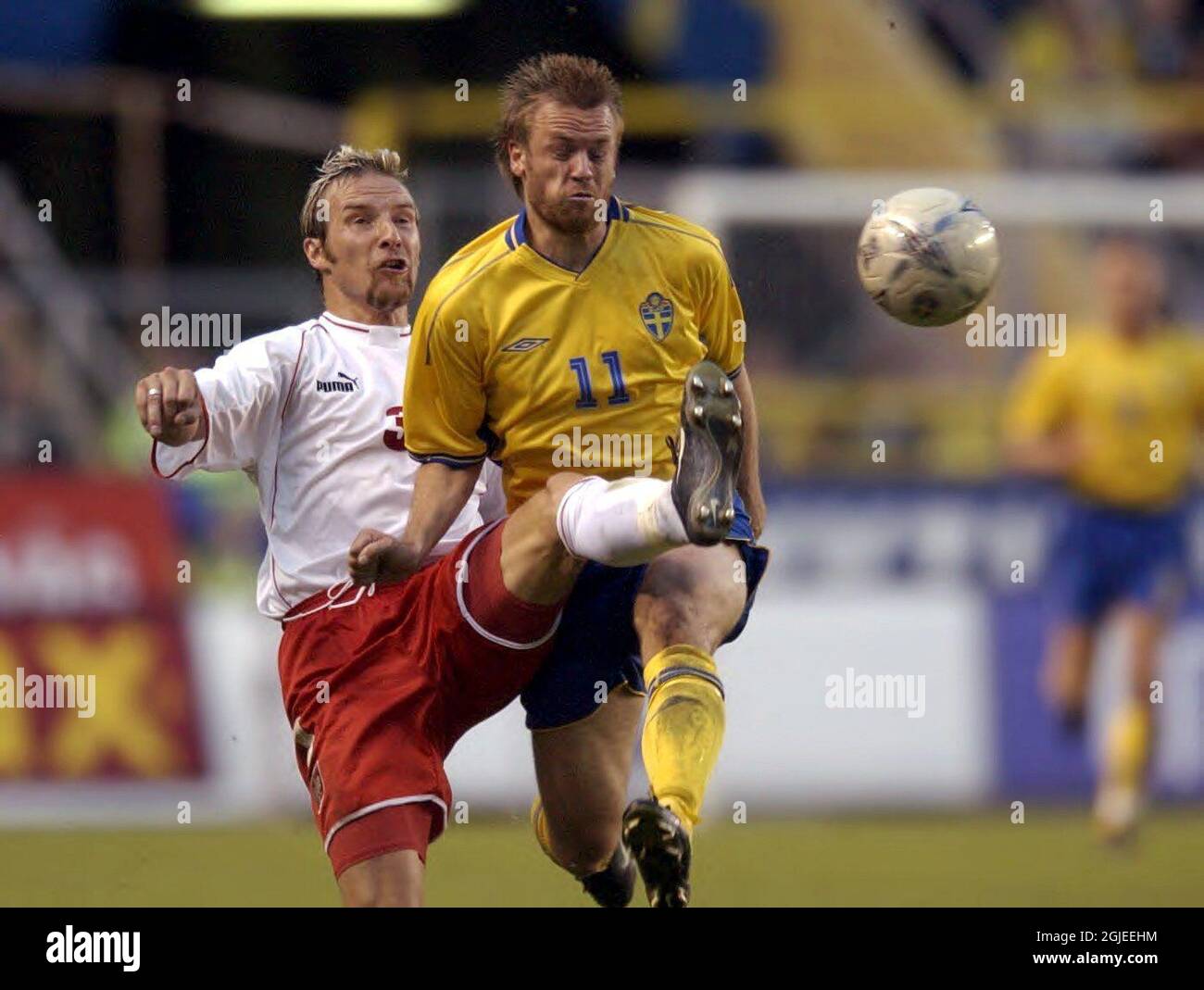 Poland's Maciej Stolarczyk (l) tackles Sweden's Mattias Jonsson (r