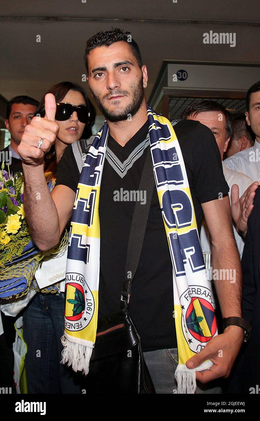 Spanish Daniel Gonzalez GUIZA with his wife Nuria Bermudez is surrounded by supporters and officials upon his arrival at Ataturk Airport in Istanbul Stock Photo