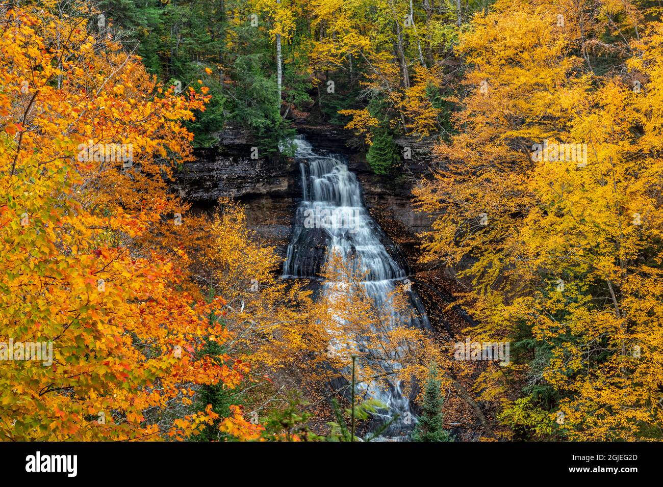Brilliant Fall color frames Chapel Falls at Pictured Rocks National ...