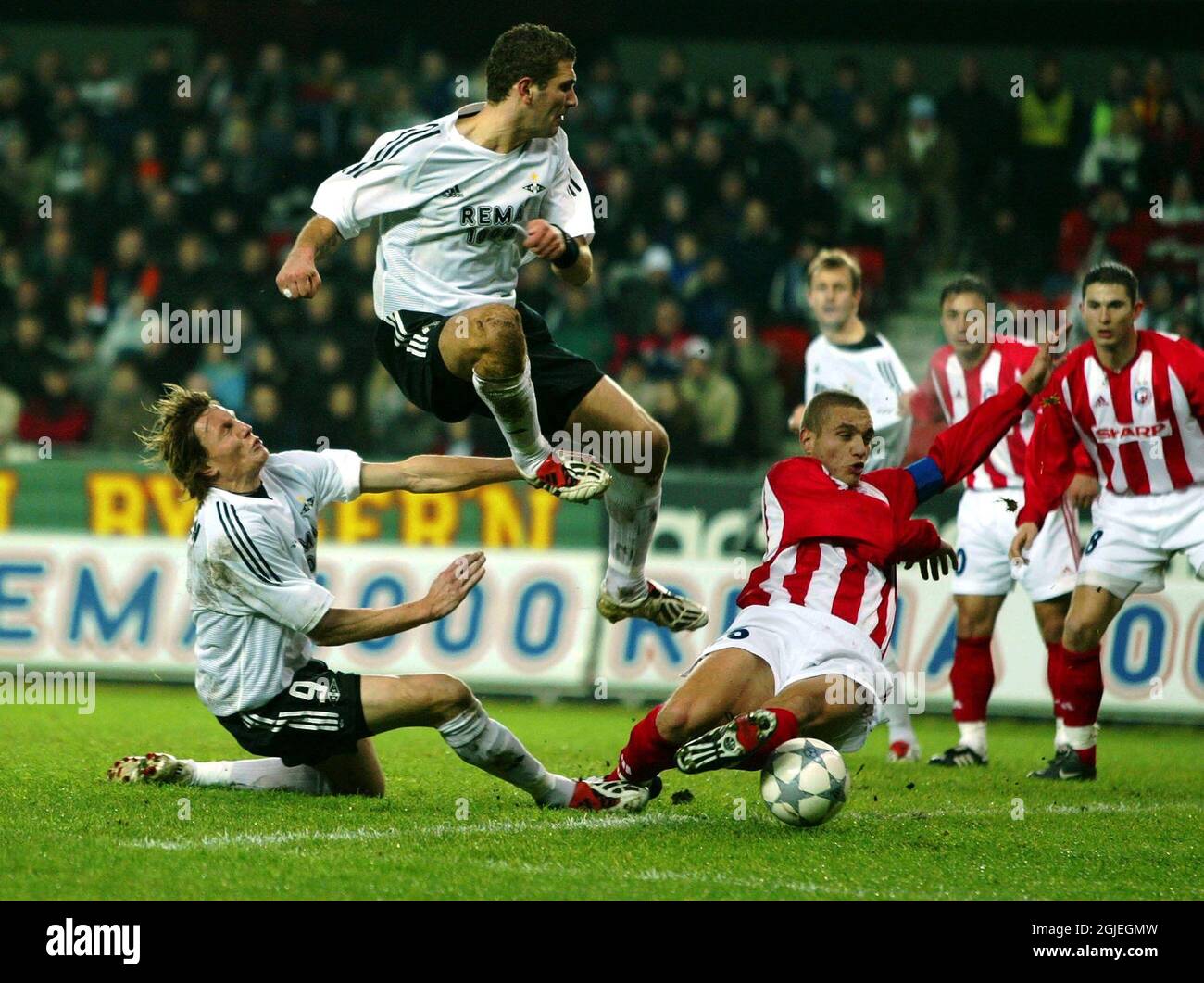 Rosenborg's Azar Karadas (c) and Frode Johnsen (l) try to get a shot at goal Stock Photo