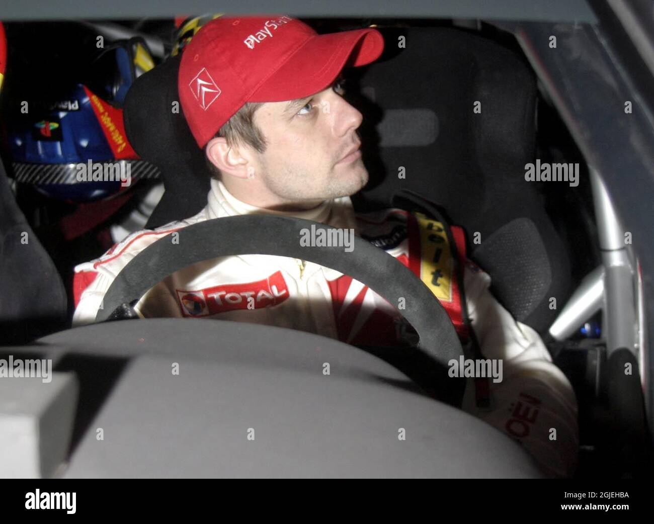 Sebastien Loeb sits in his Citreon between stages Stock Photo - Alamy