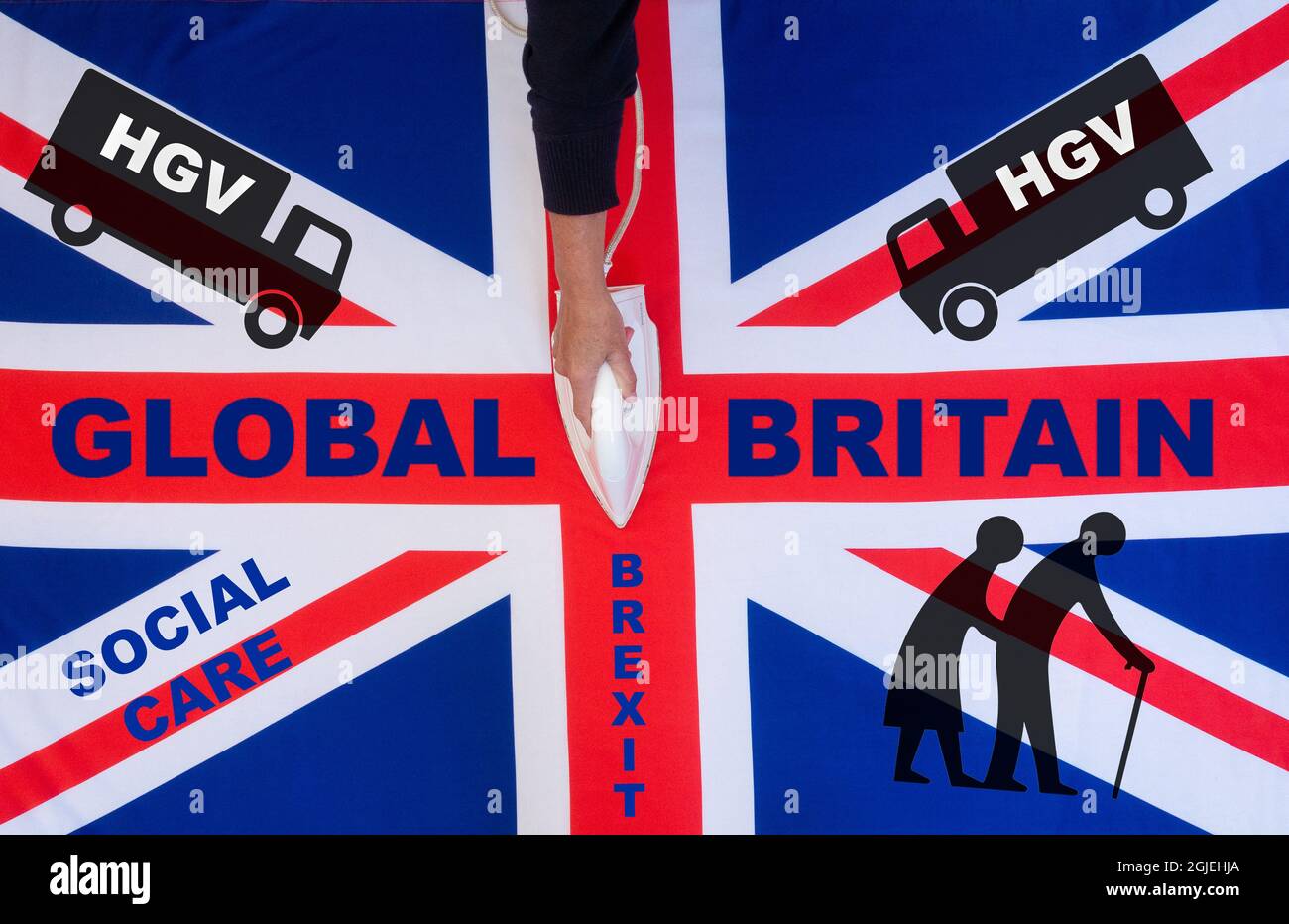 Woman ironing a 'Global Britain' UK, Union Jack flag. Social care, HGV driver shortage, Brexit concept Stock Photo