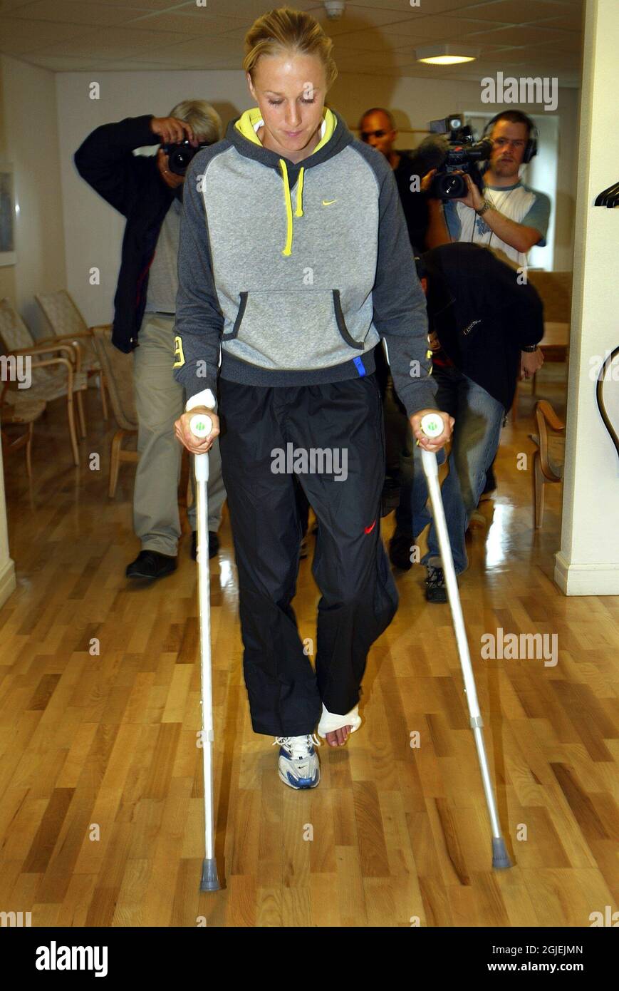 Swedish high jumper Kajsa Bergqvist on crutches following surgery on her Achilles injury