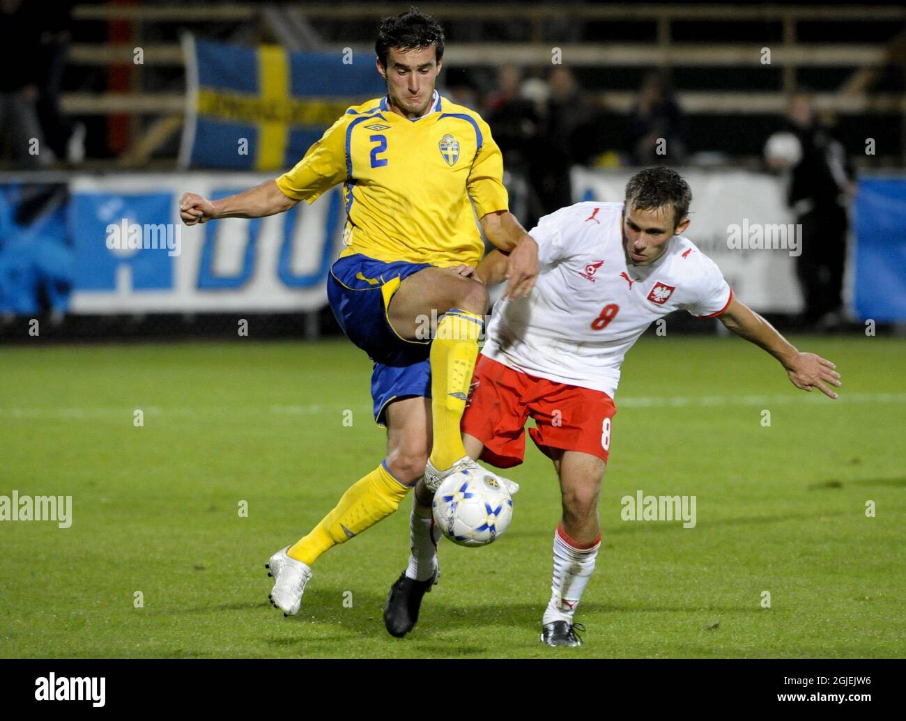 Sweden's Elmin Kurbegovic and Poland's Maciej Rybus battle for the ball Stock Photo