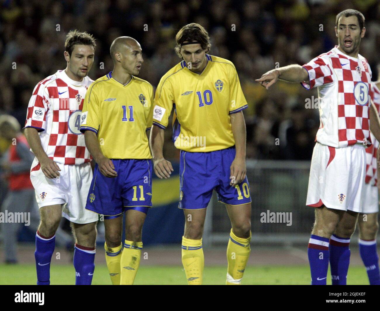 Croatia's Igor Tudor (r) asks teammates to mark Sweden's Henrik Larsson (2nd l) and Zlatan Ibrahimovic (2nd r) as Robert Kovac (l) comes across to help Stock Photo