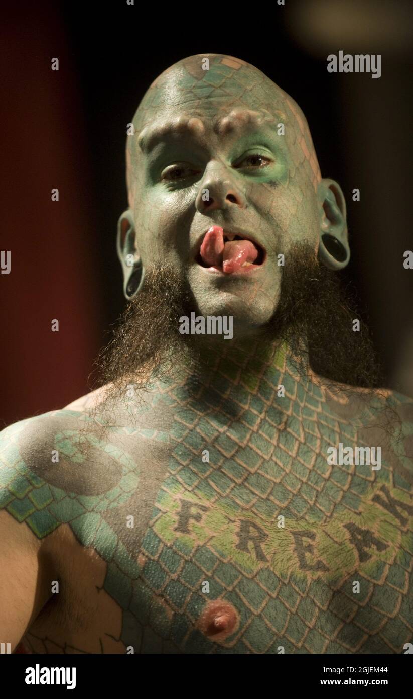 The Lizard man, Eric Sprague, of Fort Campbell, KY, USA during the Stockholm Inkbash tattoo fair Saturday. He has full body tattoo of green scales, sharpened teeth and green-inked lips and transformed ears. Stock Photo