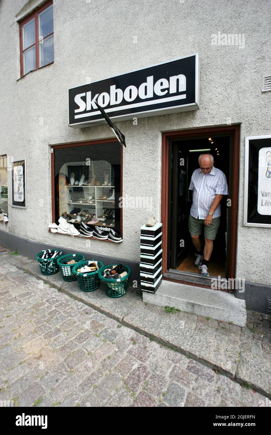A man leaving a shoe shop "Skoboden" in Visby, Gotland, Sweden Stock Photo  - Alamy