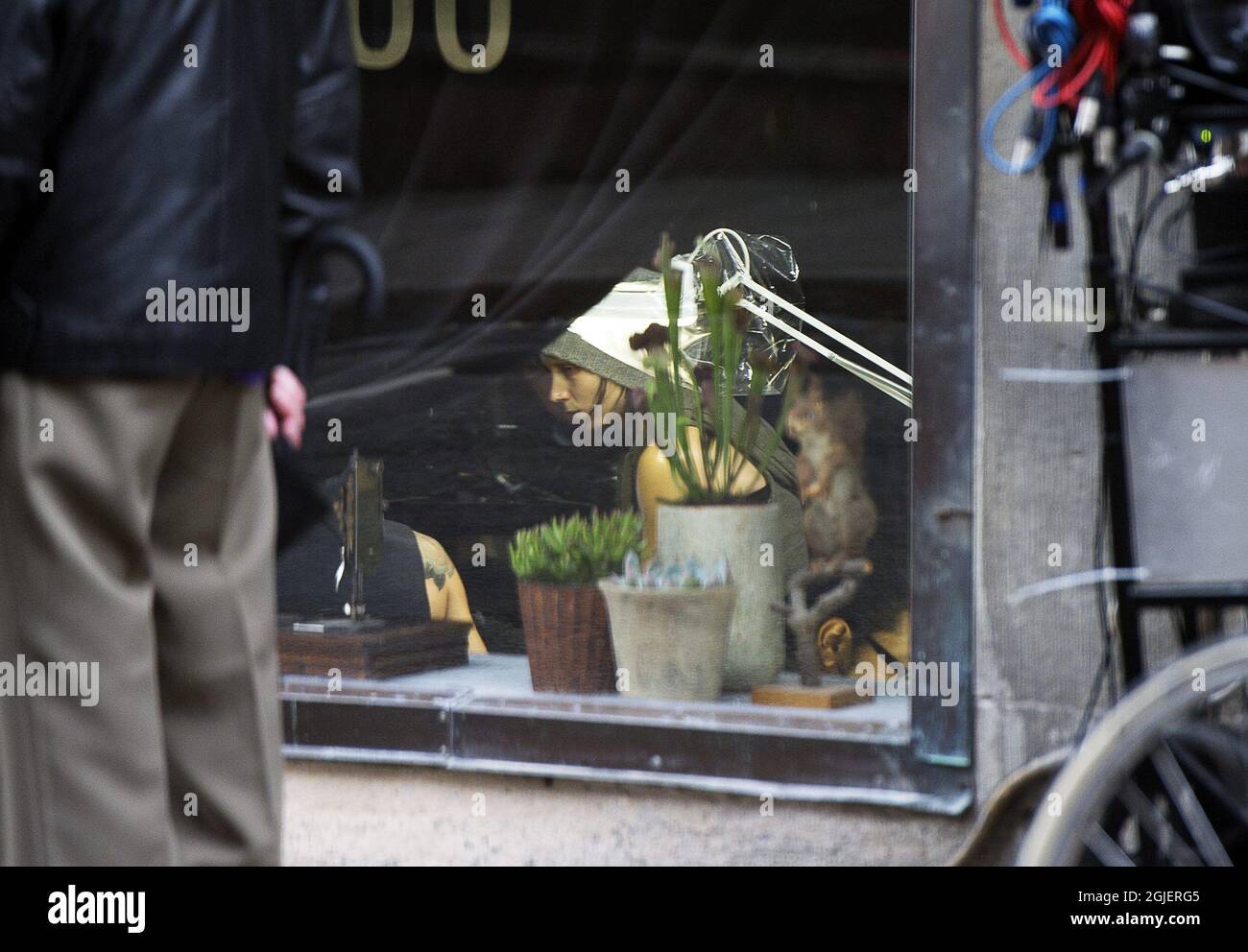 Rooney Mara is seen in a tattoo parlour in Stockholm, Sweden. Mara plays  the role of Lisbeth Salander in the movie \, image size:1300x992