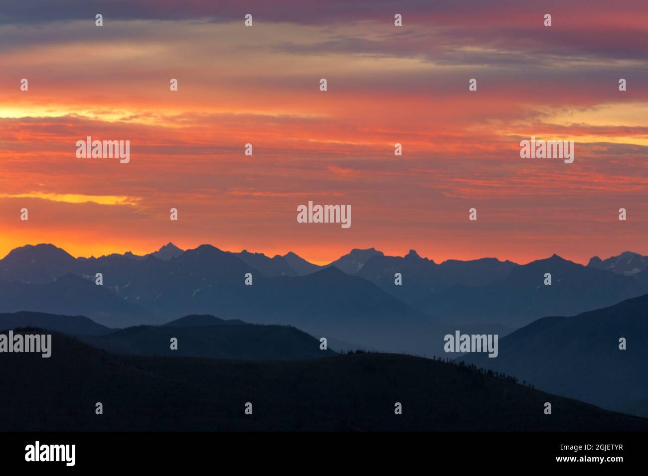 Sunrise looking at mountain peaks of Glacier National Park from Werner ...