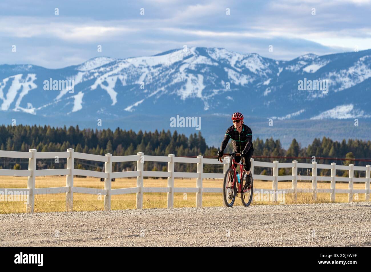 Bicycling on gravel roads of the Flathead Valley, Montana USA. (MR) Stock Photo