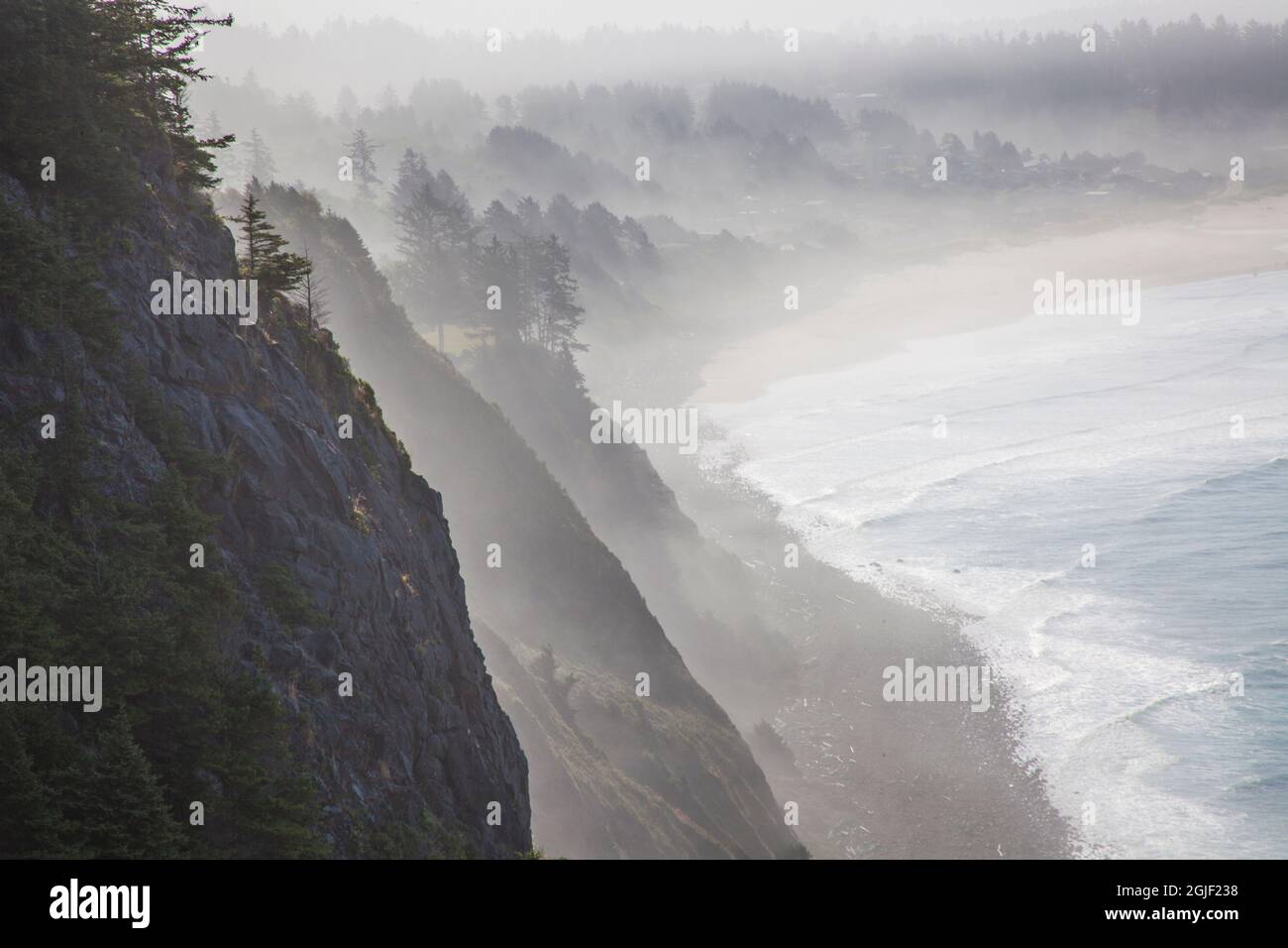 USA, Oregon, Oswald West State Park and cliff bluffs looking towards Manzanita with lifting fog Stock Photo