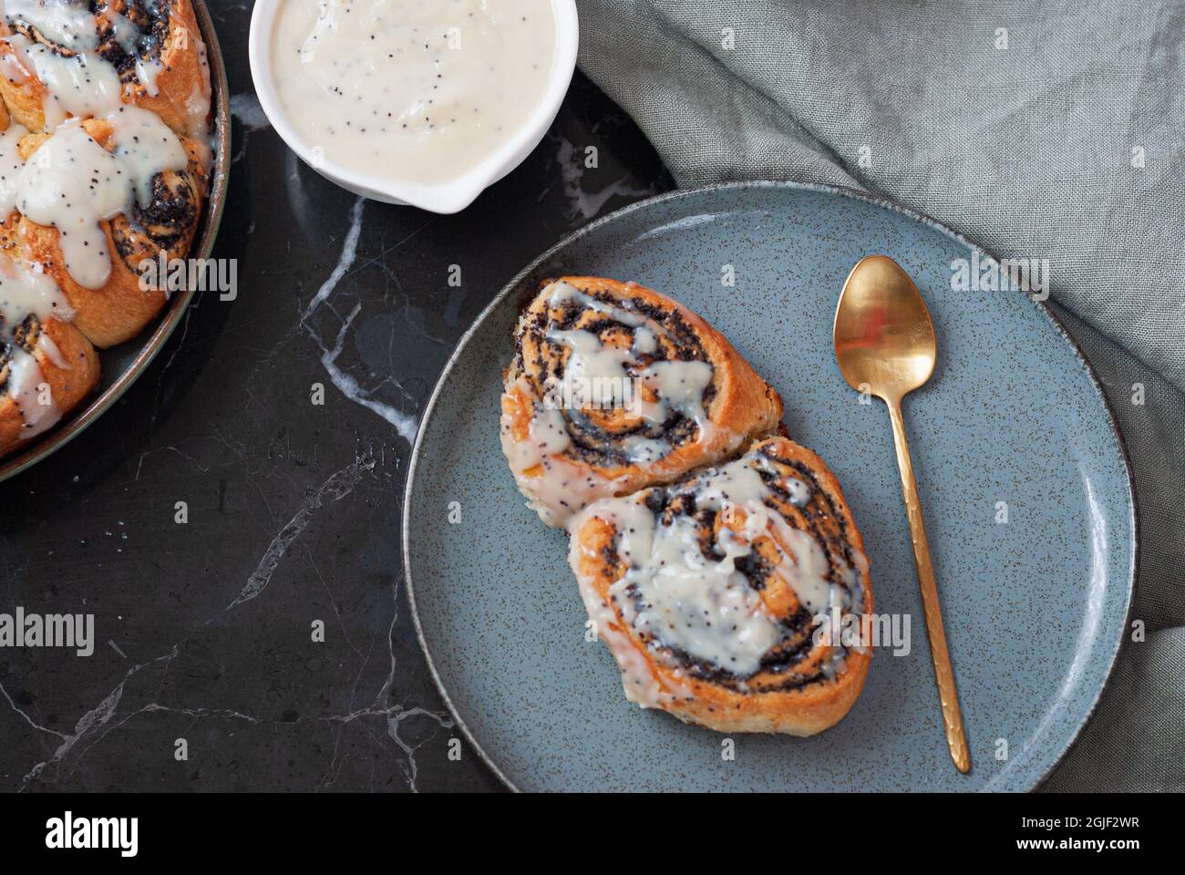 Cinnamon roll with poppy seeds Stock Photo - Alamy