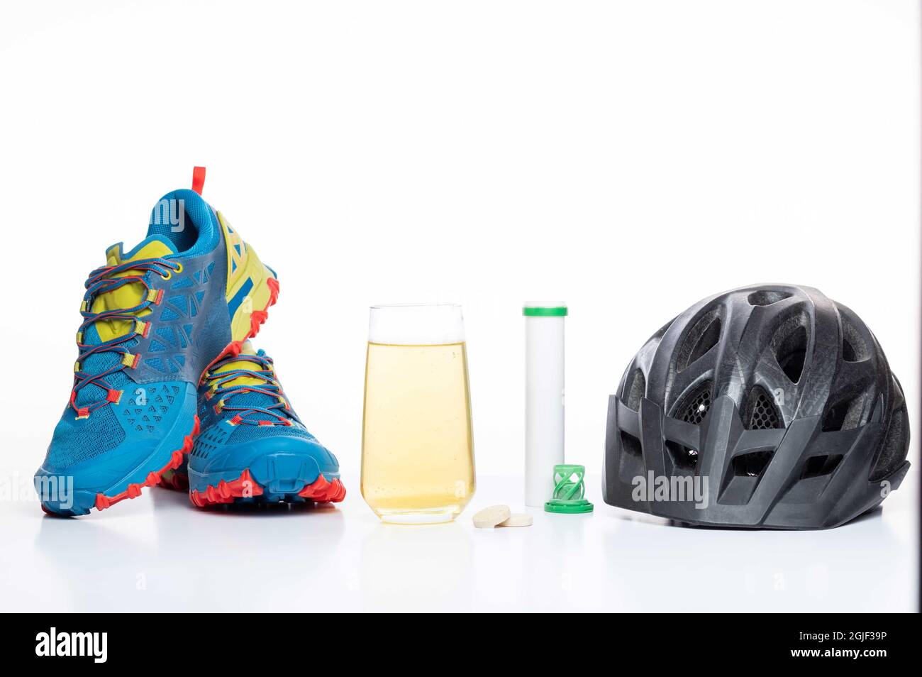 Bicycle helmet and sneakers. Bike Clothing and isotonic. Sports vitamins  and minerals Stock Photo - Alamy