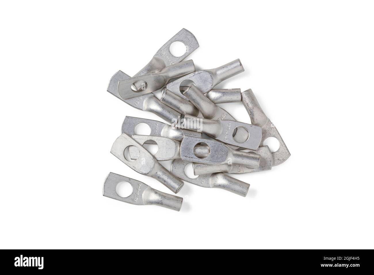 Handful of tinned copper electrical lugs for wiring electrical circuits isolated on white Stock Photo