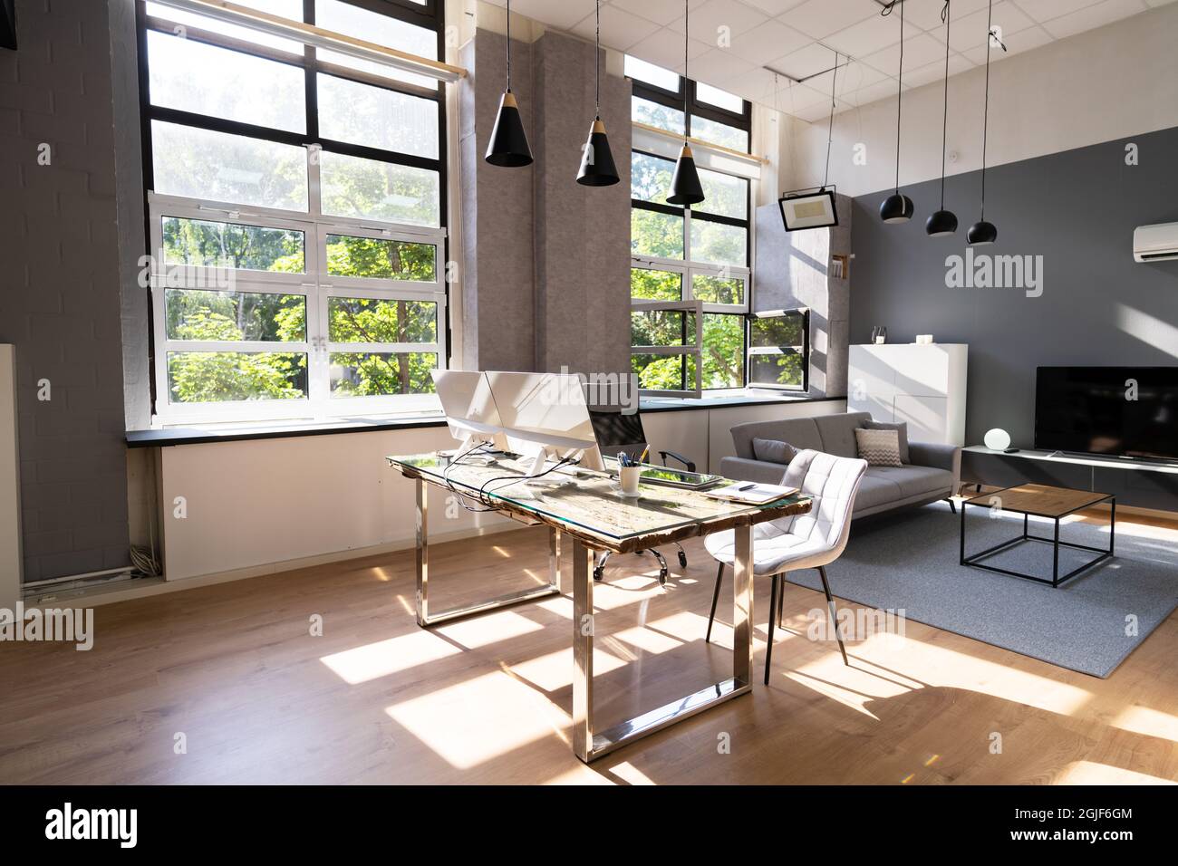Work From Home Desk With Desktop Computer In Modern Home Stock Photo