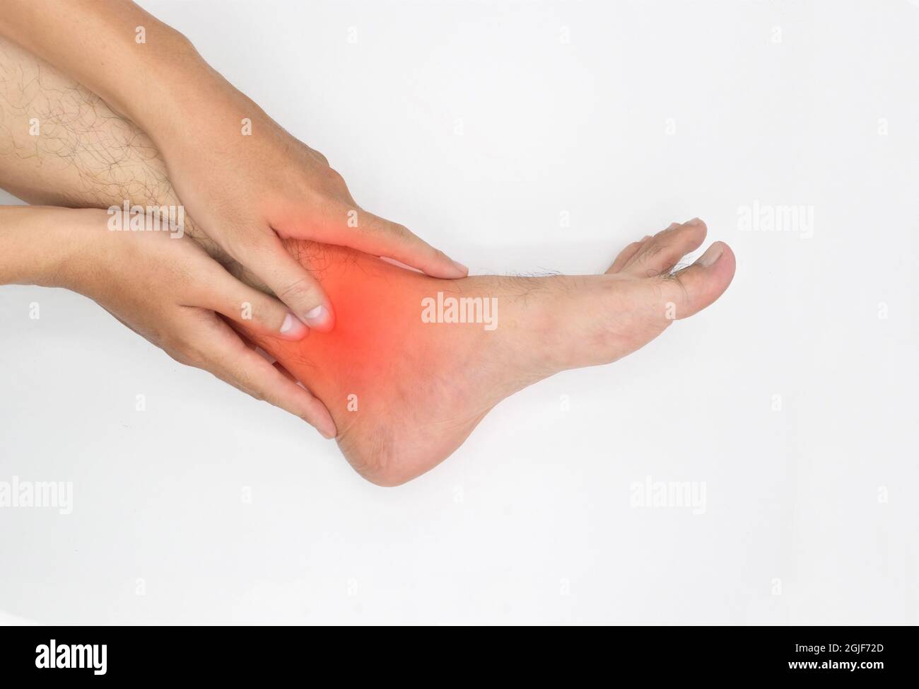 Inflammation of Asian young man’s ankle joint and foot. Concept of