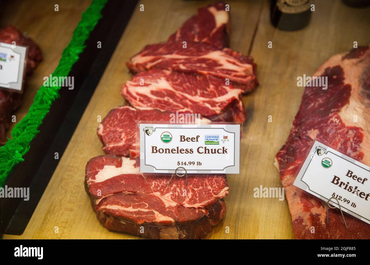 Local butcher shop with raw meat in display case in Middleburg, town in
