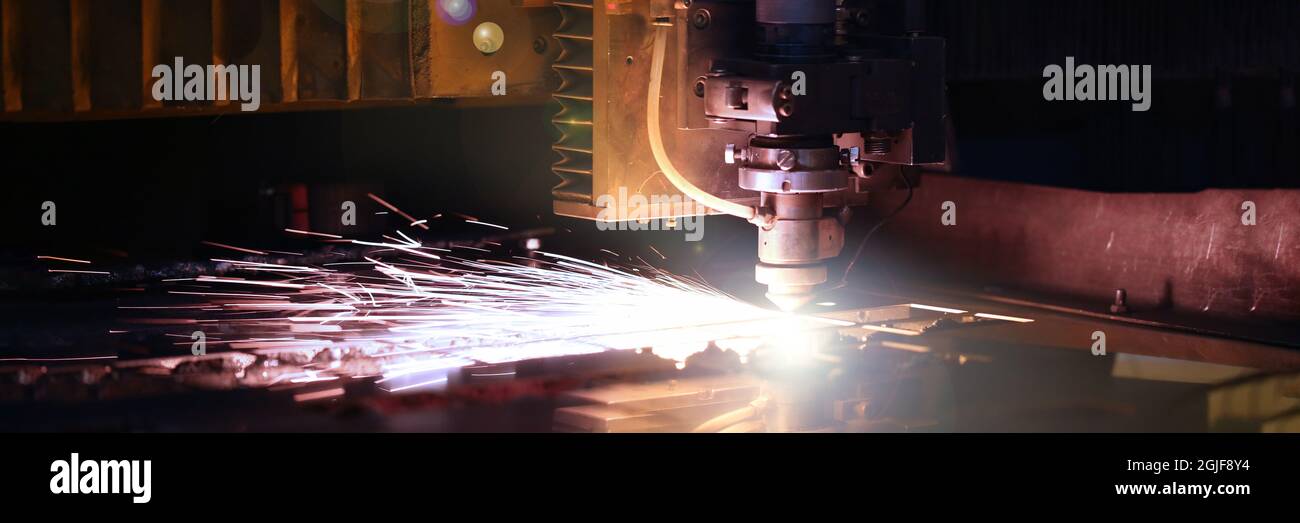 Sparks fly out machine head for metal processing Stock Photo