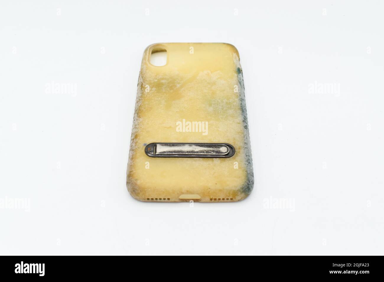 Old and dirty silicon phone case due to yellow stains and mold