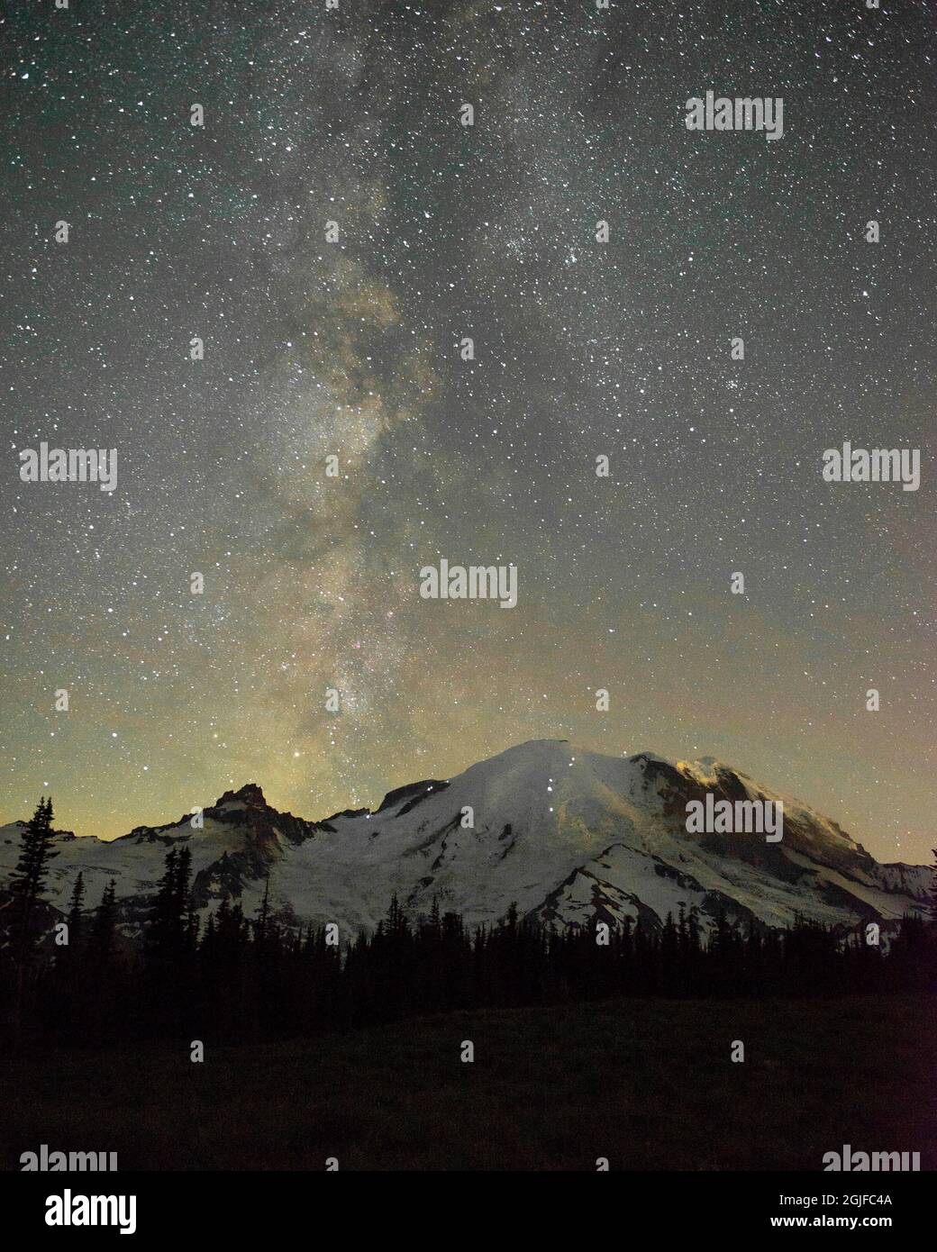 The lights of climbers can be seen on the mountain as the Milky Way