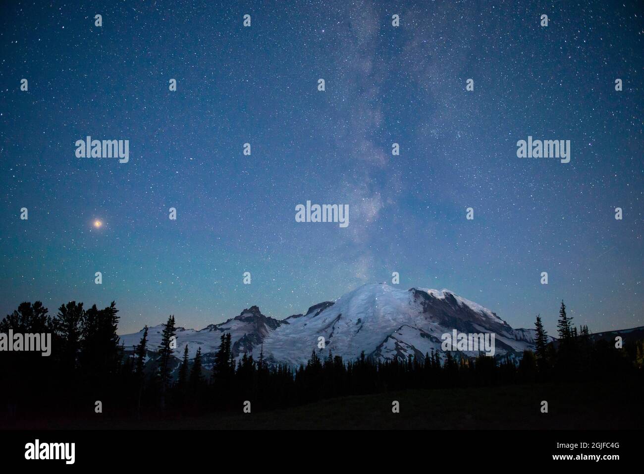 The lights of climbers can be seen on the mountain as the Milky Way