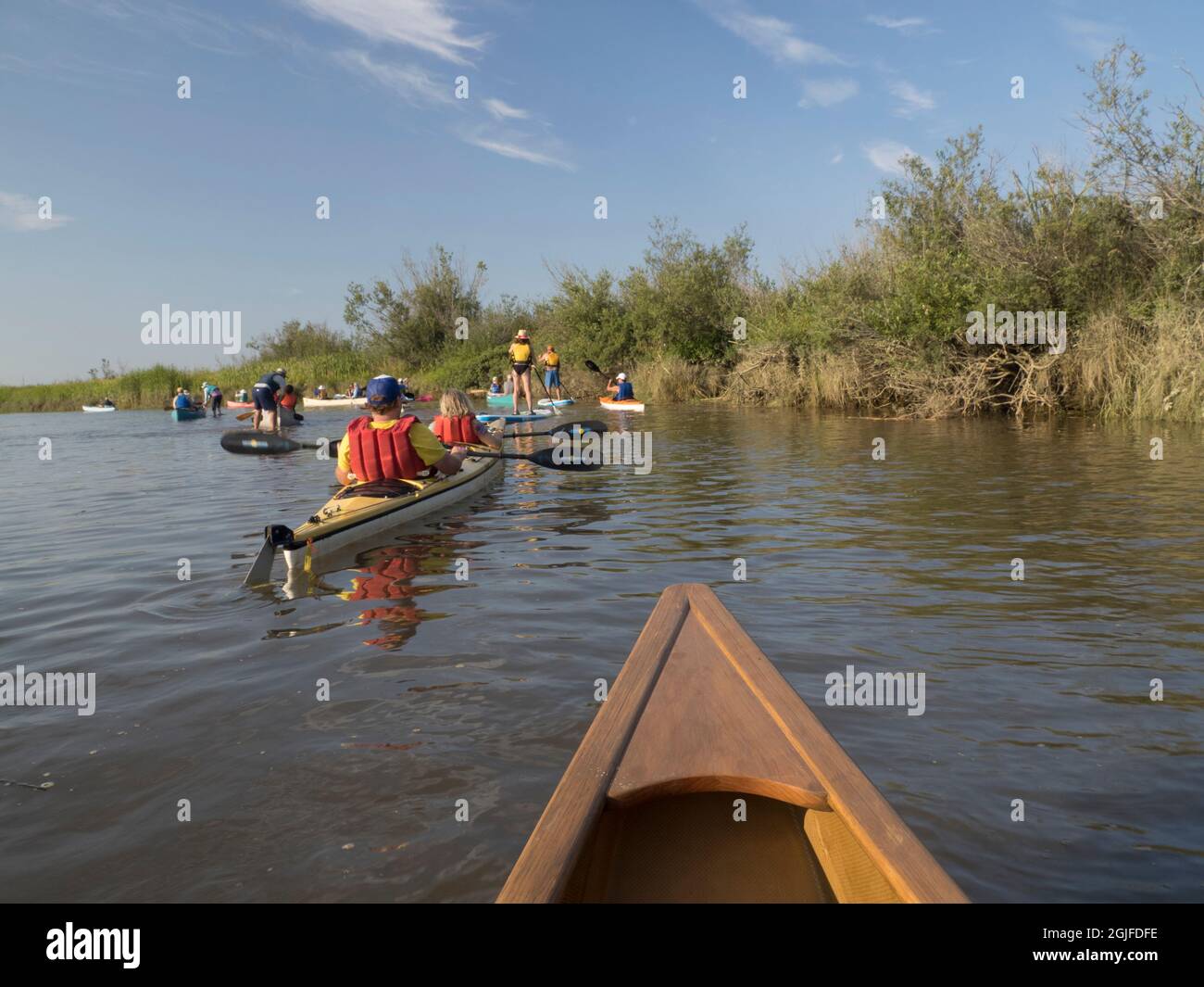 Usa, Washington State, Mt. Vernon, Skagit Flats, people in canoes and on stand-up paddleboards (MR) Stock Photo