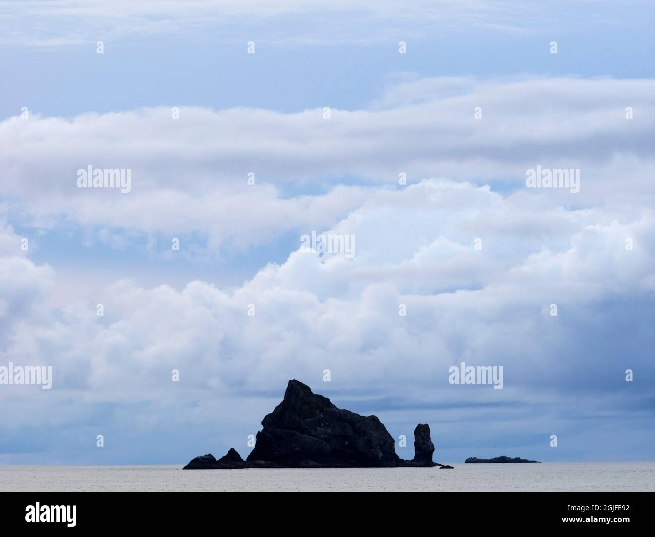 WA, Olympic National Park, Rialto Beach, Seastack and Clouds Stock Photo