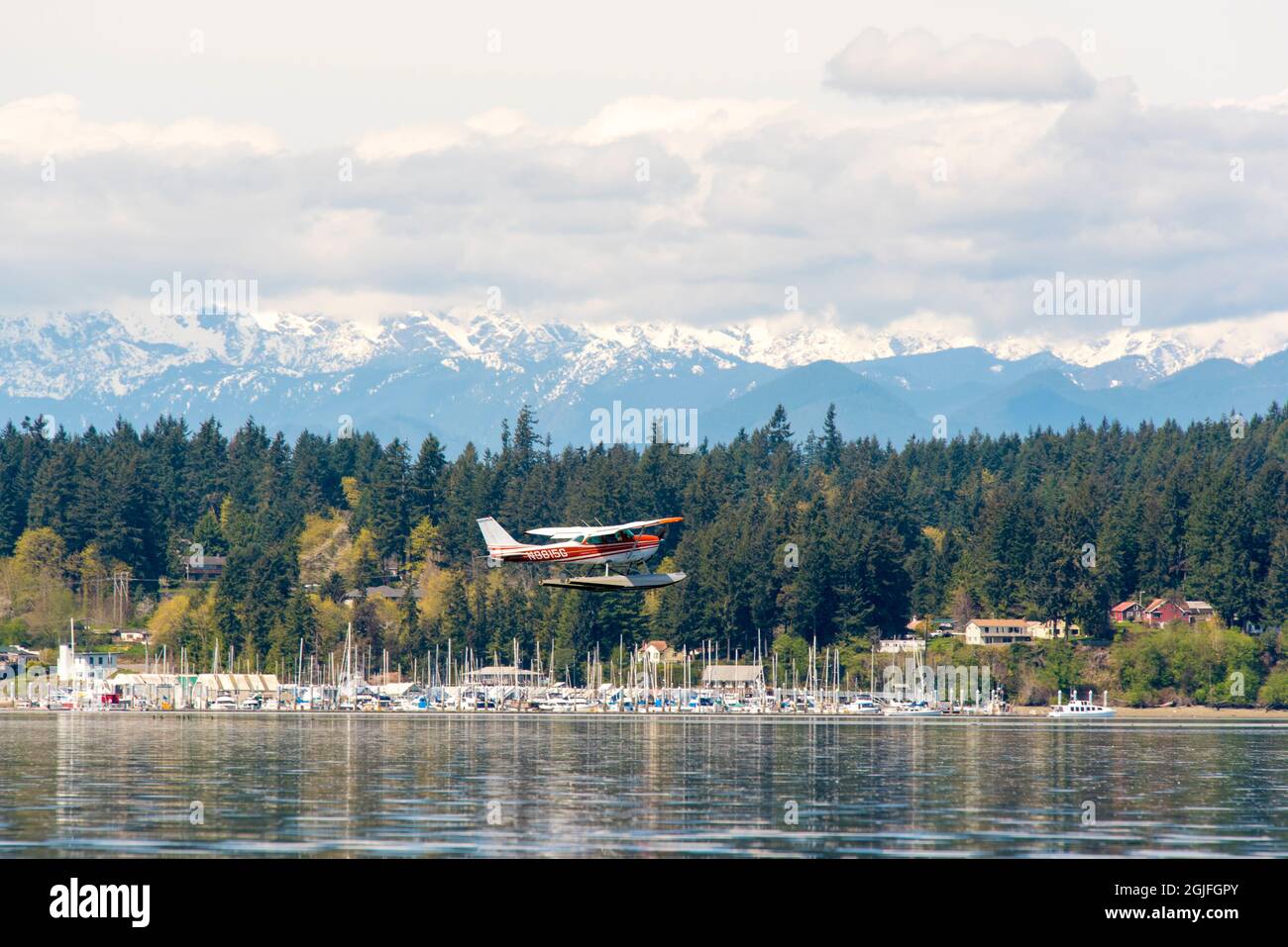 USA, Washington State, Puget Sound. Float plane practicing patterns ...