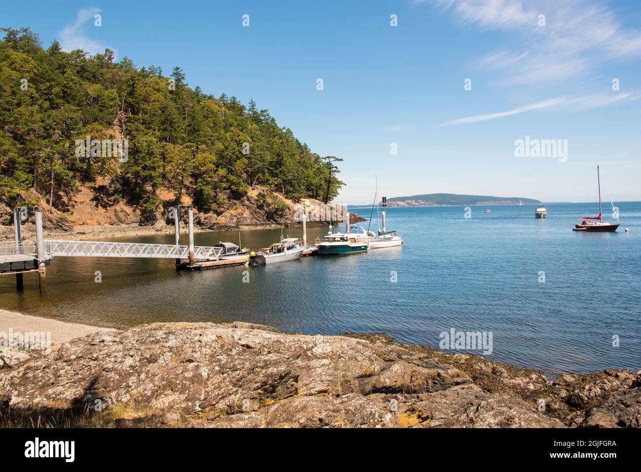 USA, Washington State, San Juan Islands. Jones Island State Marine Park dock. View to Waldron