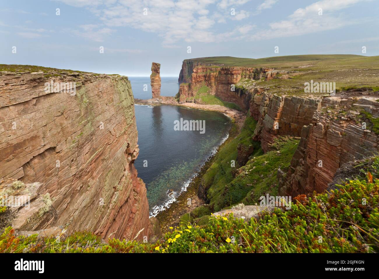 Rugged coastline of Hoy with sea stack, Orkney Isles Stock Photo