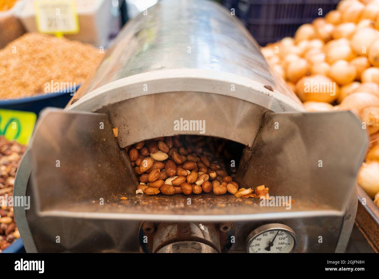 Roasting and blanching peanuts. Process of peeling peanuts in machine Stock Photo Alamy