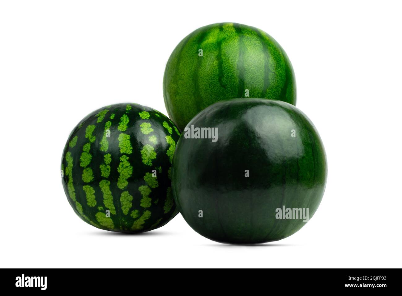 group of three ripe watermelons of different varieties, green and striped on a white background. Isolated. Direct view. Harvest. Stock Photo