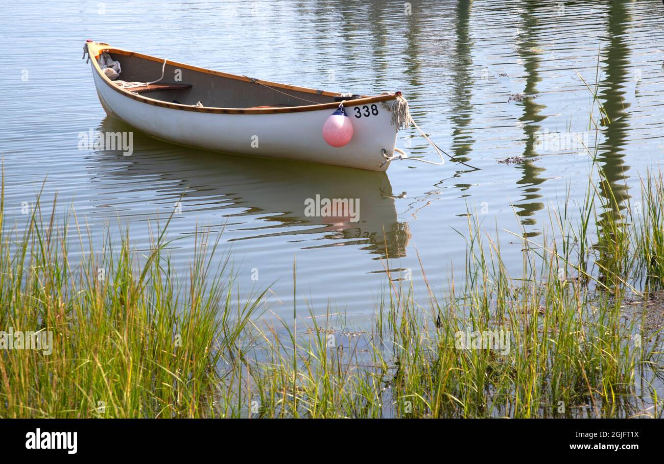 A moored dory in Allens Harbor, in Harwich, Massachusetts on Cape Cod, USA Stock Photo