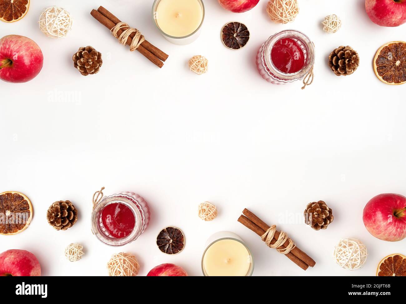 Autumn flat lay composition of apples, fall foods and decor on white background. Ingredients for jam or mulled wine. Autumn or winter holiday food concept. Creative trendy flat lay with place for text. Stock Photo