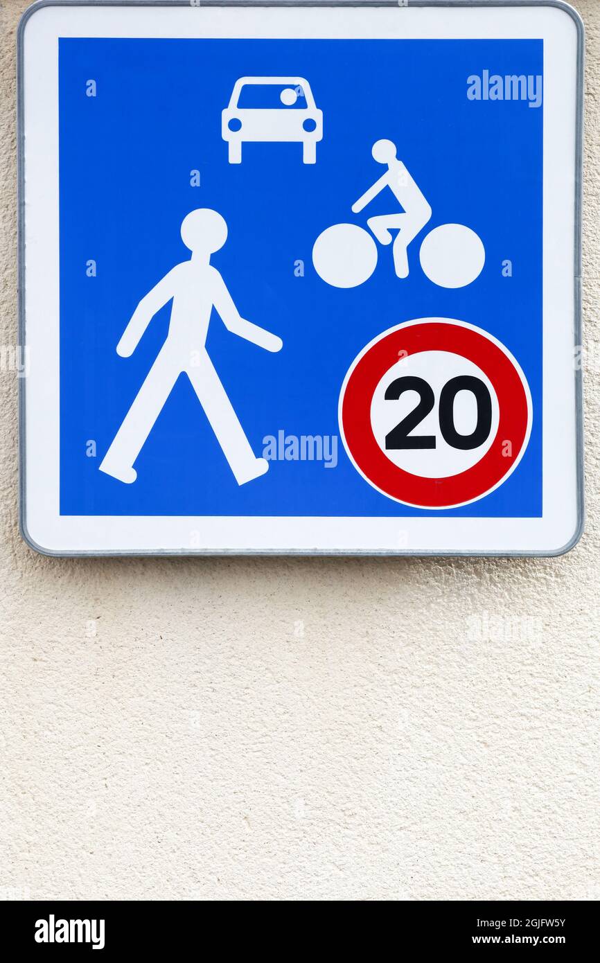 Road sign in an area with speed 20 kilometers per hour maximum allowed in France Stock Photo