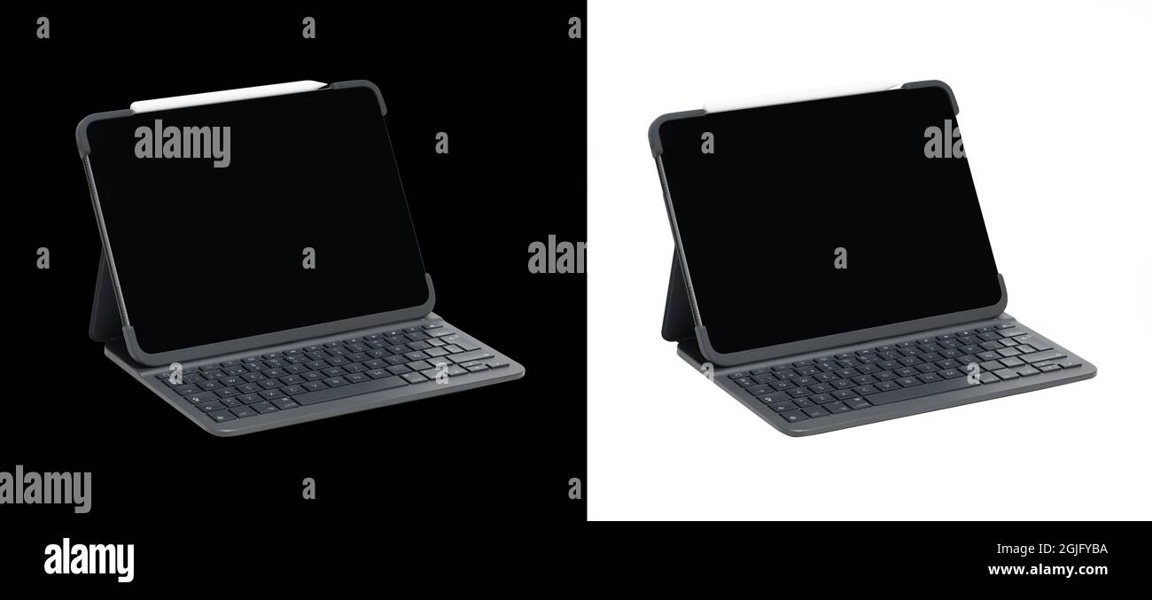 Tablet with a keyboard on a white and black backgrounds Stock Photo