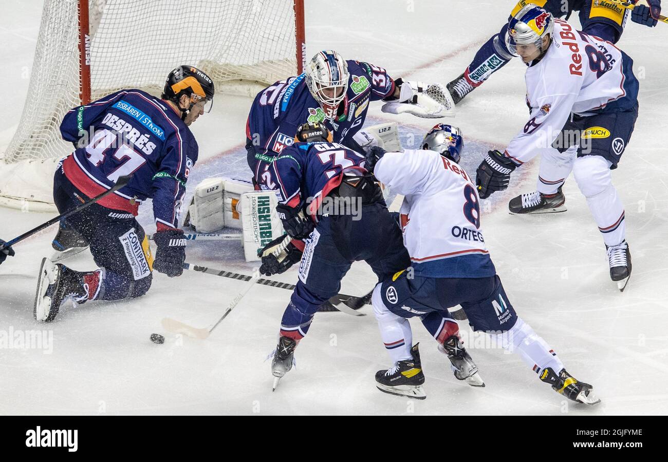 Berlin, Germany. 09th Sep, 2021. Ice hockey: DEL, Eisbären Berlin - EHC Red Bull München, Hauptrunde, Matchday 1, Mercedes-Benz Arena. Berlin's Simon Despres (l-r), goalie Mathias Niederberger and Kevin Clark fight for the puck against Red Bull Munich's Austin Ortega and Philip Gogulla. Credit: Andreas Gora/dpa/Alamy Live News Stock Photo