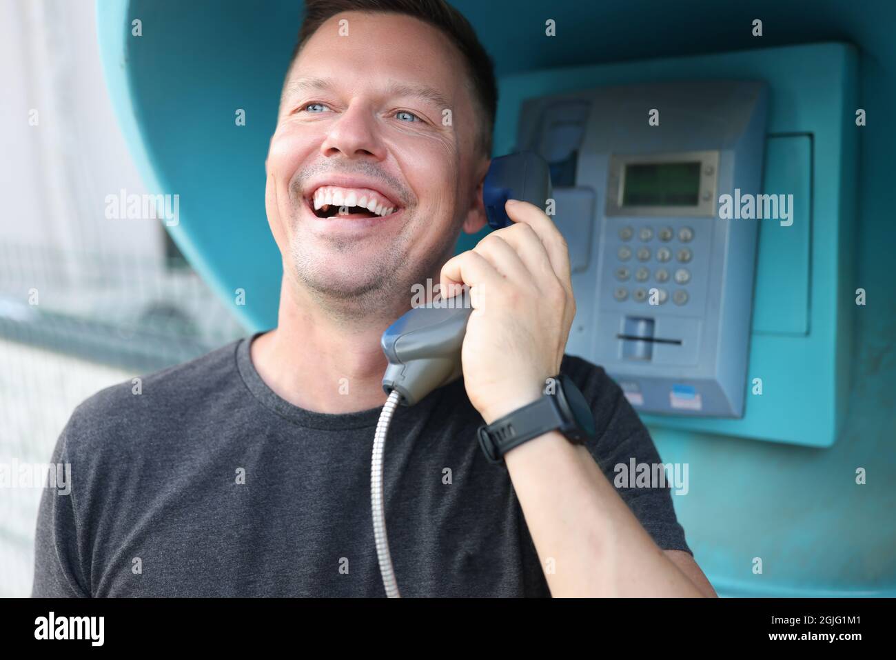 Man talking in telephone booth hi-res stock photography and images - Alamy