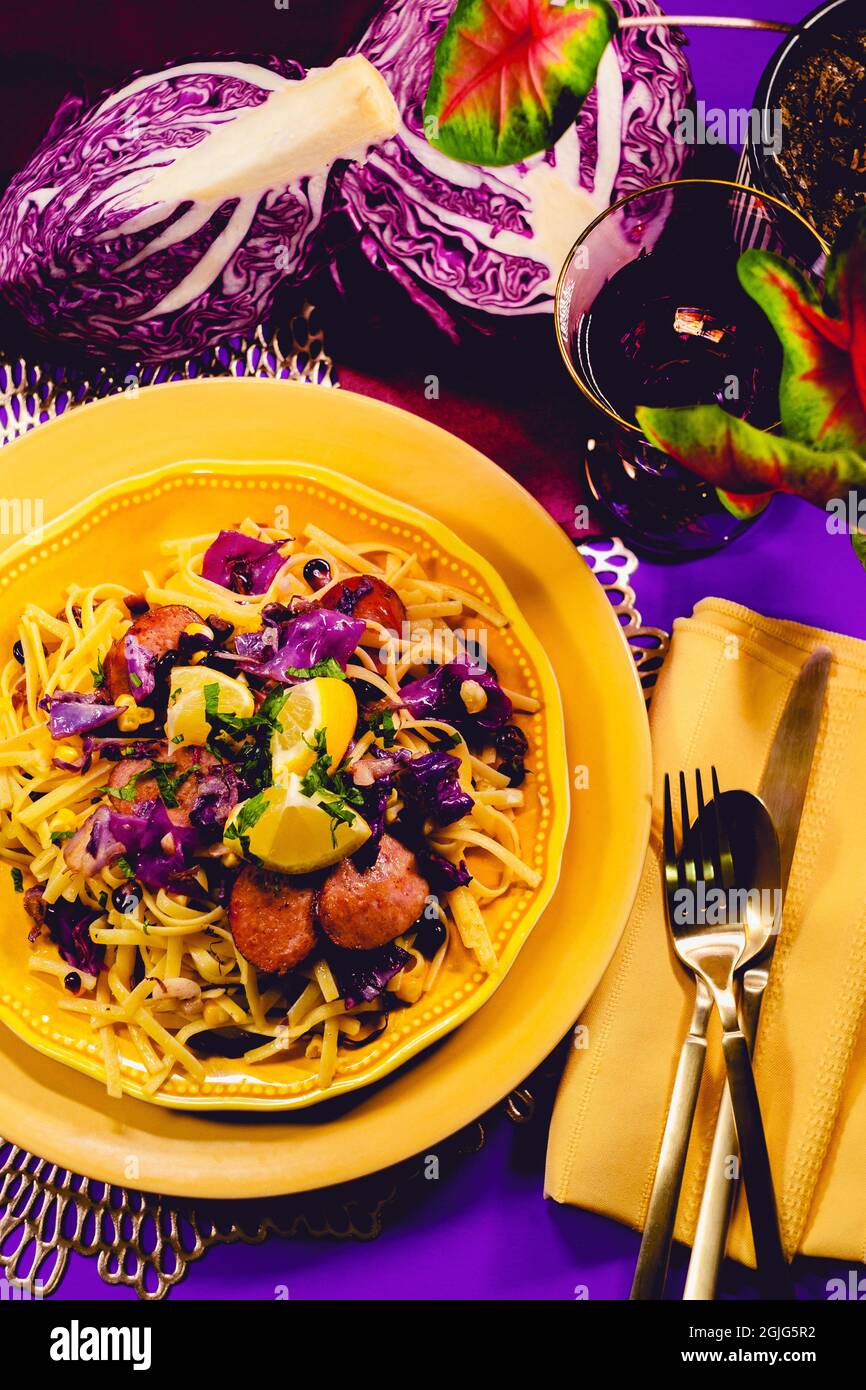 German kielbasa sausage with red cabbage linguine and purple and yellow